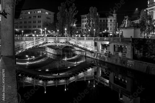 Famous three bridges at the Preseren square in the center of Ljubljana illuminated at night photo