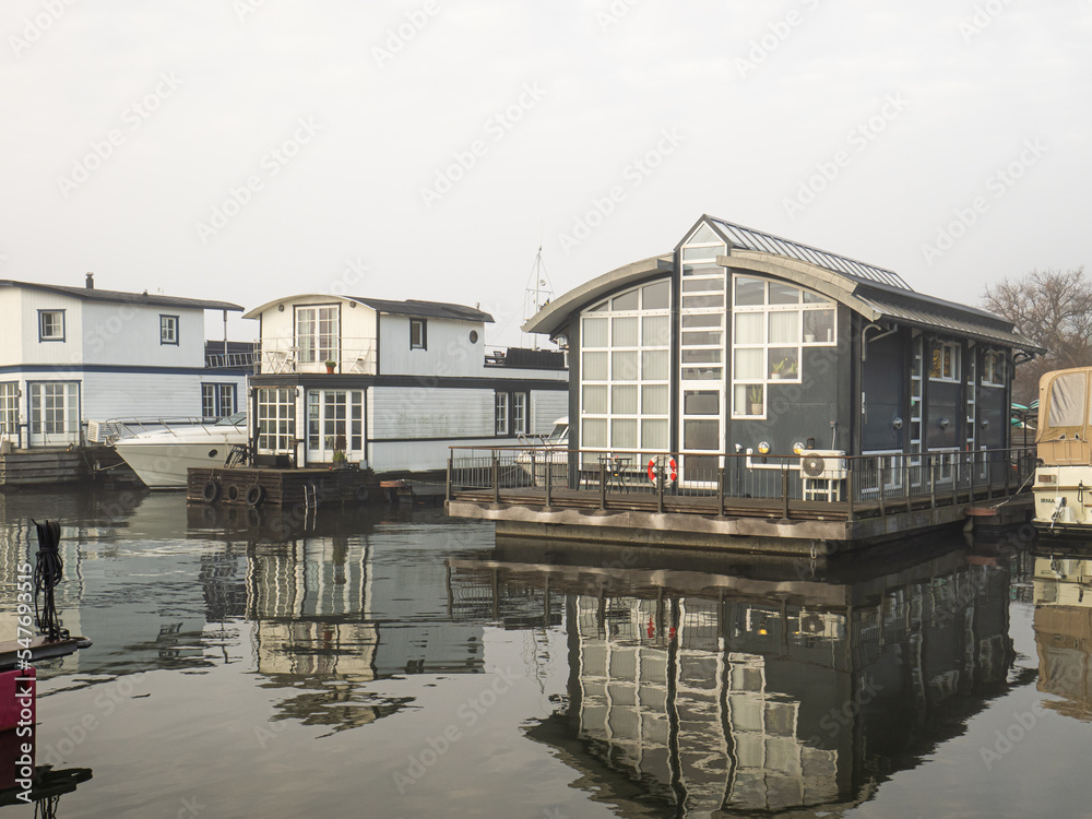 Two houseboats on an overcast day