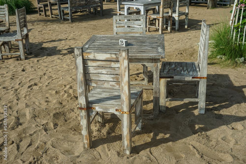 Sanur, Denpasar (12 November 2022): Cafe tables and chairs are lined up on the beach Sanur, Denpasar (12 November 2022): Cafe tables and chairs are lined up on the beach