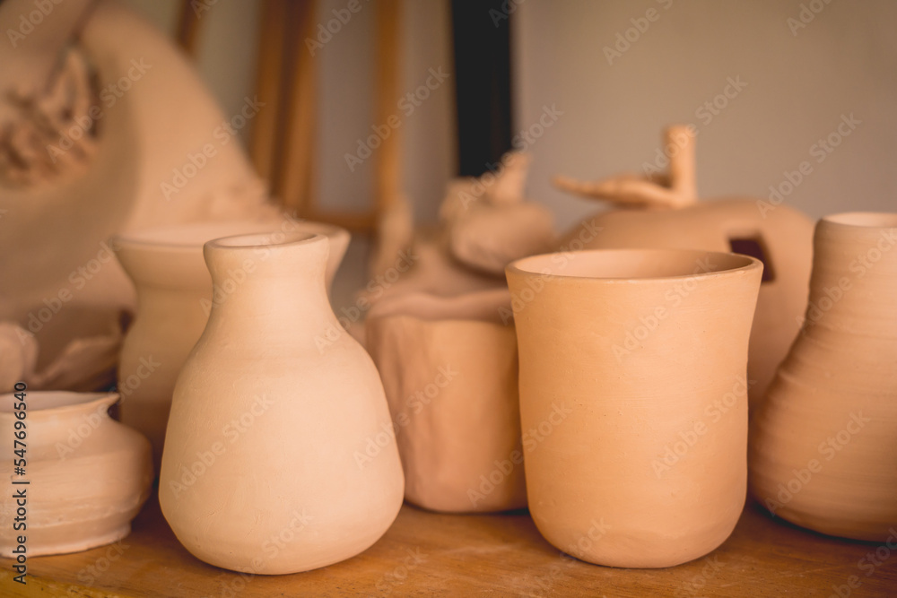 Ceramic vase on the table at the workshop Ceramic vase on the table at the workshop