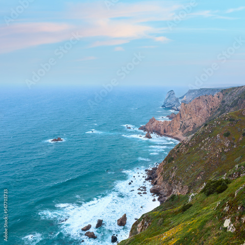 Atlantic ocean coast (granite boulders and sea cliffs) in cloudy weather. View from Cape Roca (Cabo da Roca), Portugal.