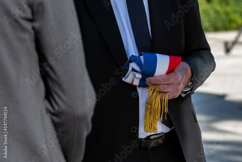 An official people hold the tricolor scarf of french deputy or mayor  photo