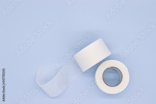 hypoallergenic sugical tape on blue background photo