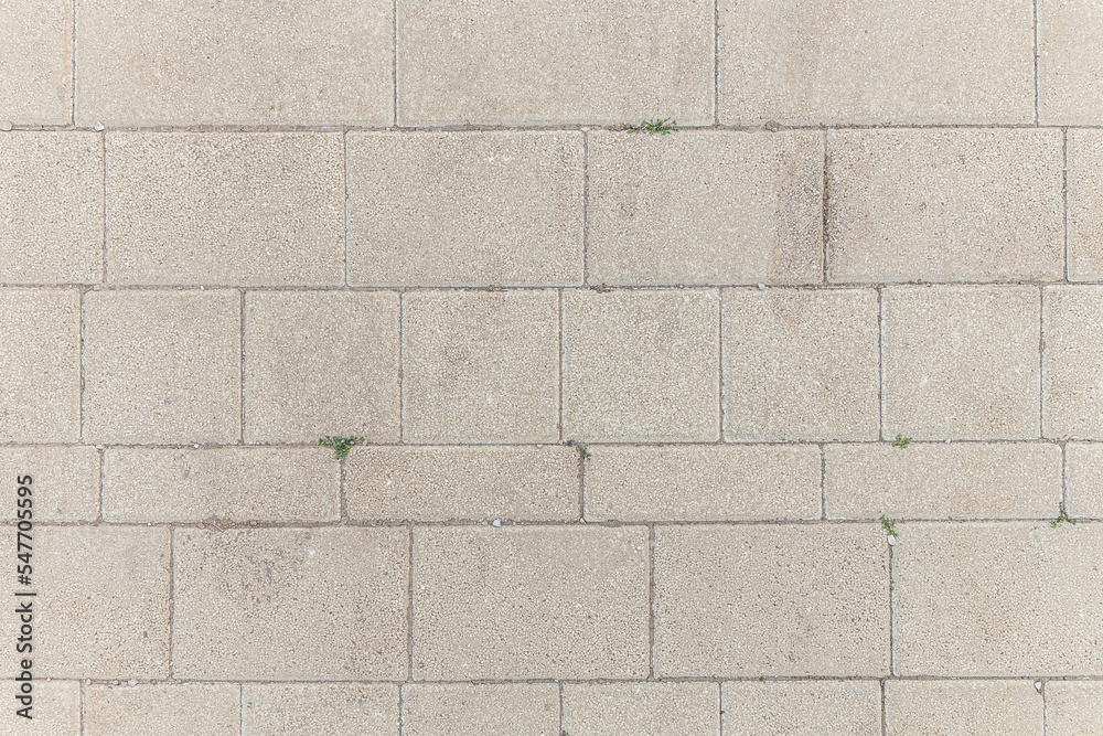 Naklejka premium abstract background of an old tiles on the track in the park close up