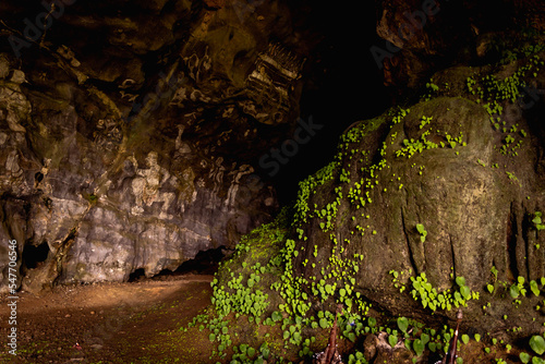 Big dark stone cave inside near entrance