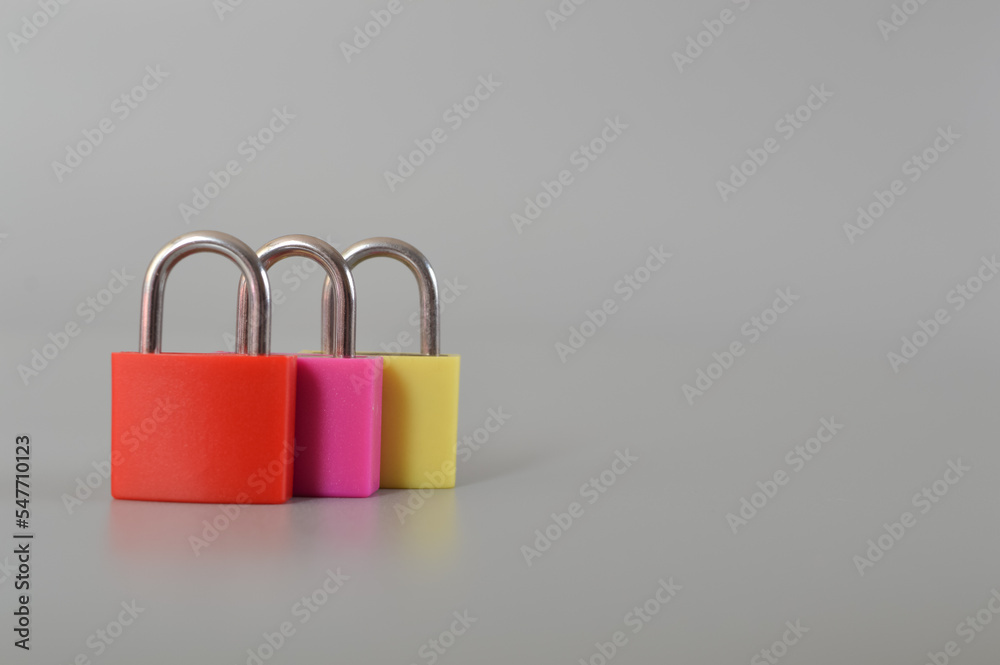 Red, pink and yellow isolated on a grey background. Copy space for the text. Red, pink and yellow isolated on a grey background. Copy space for the text.