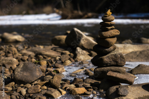 Photography Pyramid of stones collected on the bank of the river.