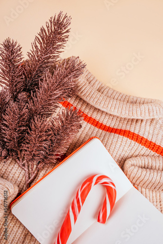 Christmas flatlay with cozy sweater and decoration