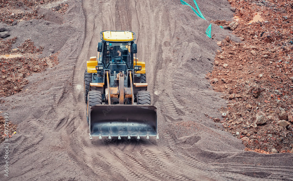 excavator loader machine during earthmoving works outdoors excavator loader machine during earthmoving works outdoors
