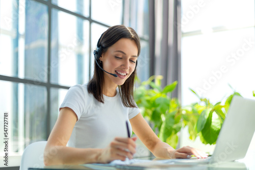 Customer support operator working in a call center office