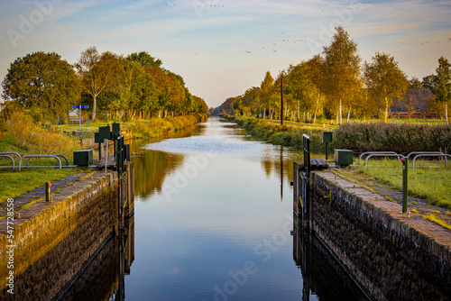 Ruiten A kanaal lock in the northeastrn corner of Netherlands on a quiet autumn morning photo