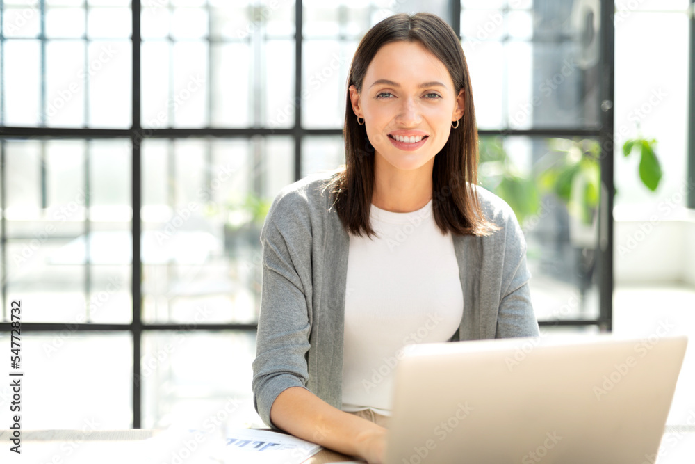 Portrait of young beautiful business woman in the office Portrait of young beautiful business woman in the office