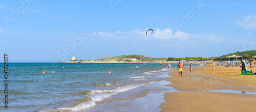 Vieste, Italy. View of the Scialmarino Beach with people on the beach and practicing water sports, on a Summer day, along the coast of Vieste. Banner header image. September 7, 2022 photo