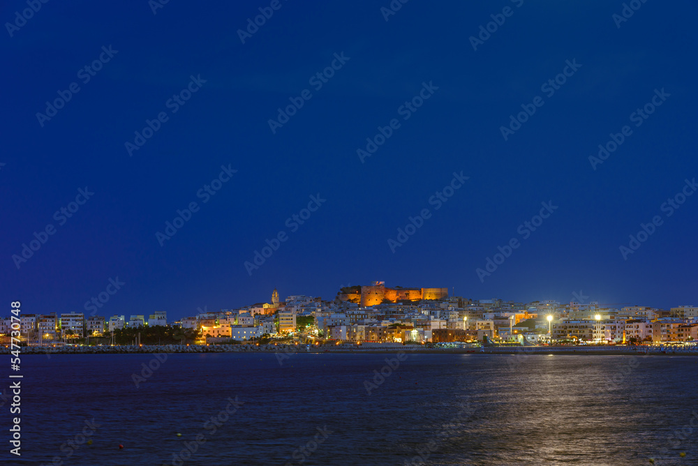 Vieste, Italy. View of the town of Vieste at night. Above, the Swabian Aragonese Castle with the illuminated historic center below. September 9, 2022.