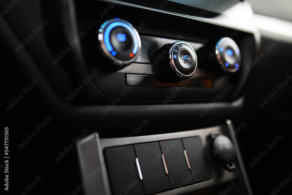 The process of choosing climate control in the car. Various controls in auto switches. Modern car interior The process of choosing climate control in the car. Various controls in auto switches. Modern car interior