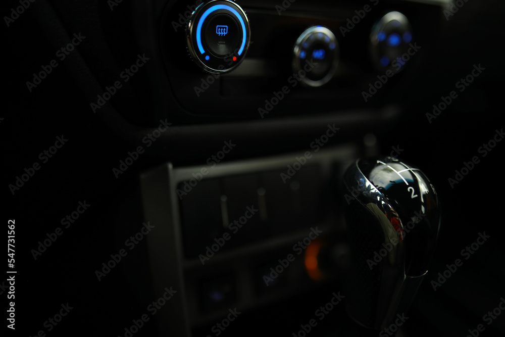 Close up view of a gear lever shift. Manual gearbox. Car interior details. Car transmission. Soft lighting. Abstract view Close up view of a gear lever shift. Manual gearbox. Car interior details. Car transmission. Soft lighting. Abstract view
