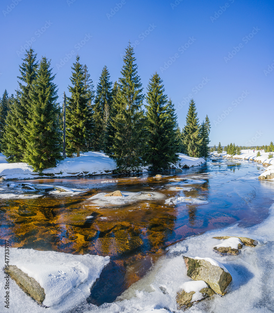Winter landscape with a view of the winding Izera River in the Izera Mountains