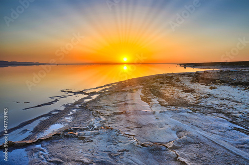 Beautiful sunrise on salt lake Chott el Djerid, Sahara desert, T photo
