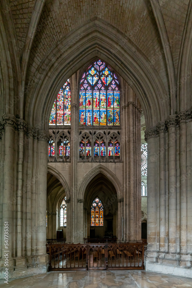 interior view of the historic Troyes Cathedral with stained glass windows and Gothic architecture