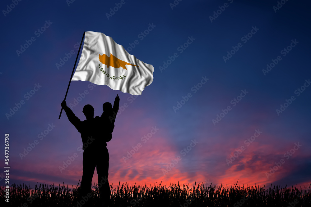 Father and son hold the flag of Cyprus