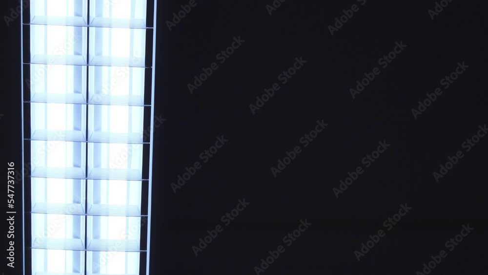 LED linear light on a black background. The lamp with the led tape