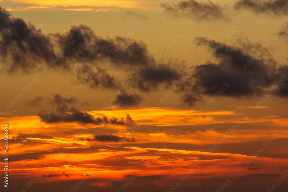 Dramatic colorful sunset sky with clouds