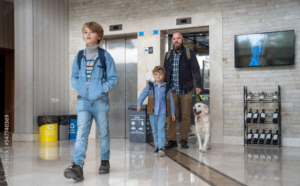 Family traveling with golden retriever dog. Father, children, pet and luggage getting out from hotel. Auto journey with kids and dog in car.