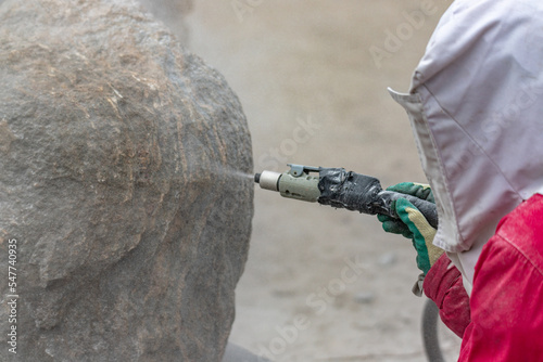 Tableau sur toile cleaning granite boulder rock surface with sand blasting method