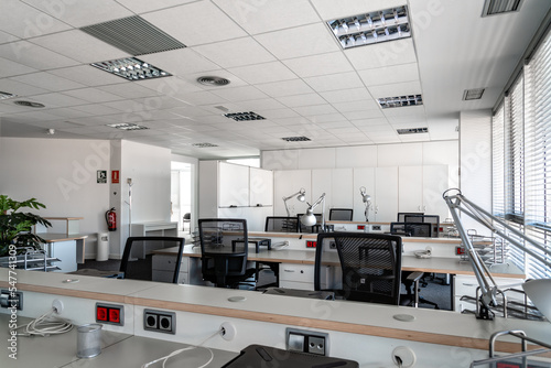 Empty places for workers in contemporary coworking. Startup business office interior at new workplace. Open space office interior