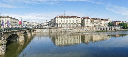 The murazzi and the Vittorio Emanuele bridge of Turin are reflected in the water of the river Po © Alessio