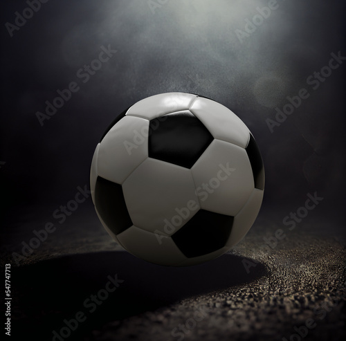 A closeup soccer ball on concrete ground with light on top