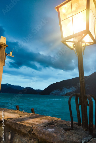 lighthouse at sunset, sky before storm, light before storm, comming storm, latern, light from latern, comming night