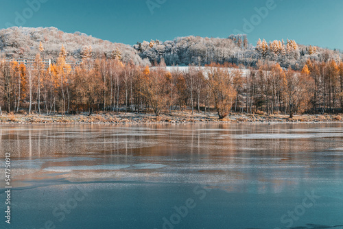 Hills reflecting in the water on a sunny winter day 