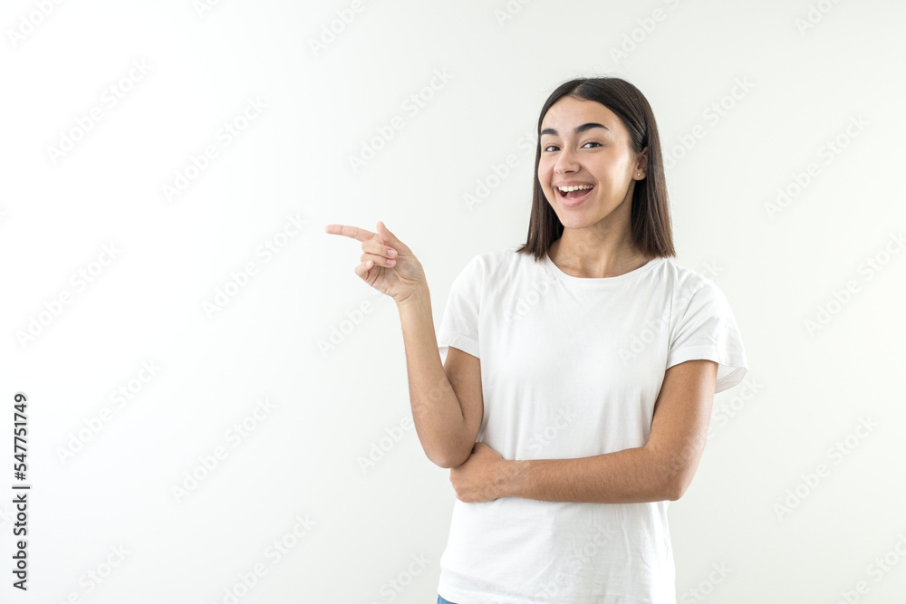 Happy girl offering and presenting a product or message over hand in empty space copy Happy girl offering and presenting a product or message over hand in empty space copy