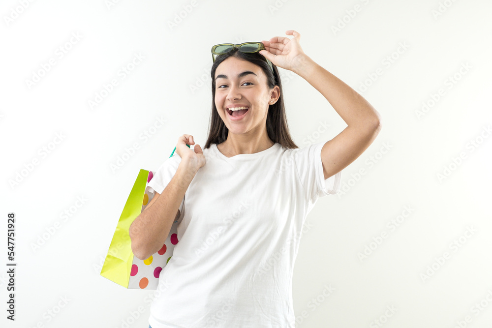 Young girl happy smile sunglasses and shopping bags Young girl happy smile sunglasses and shopping bags