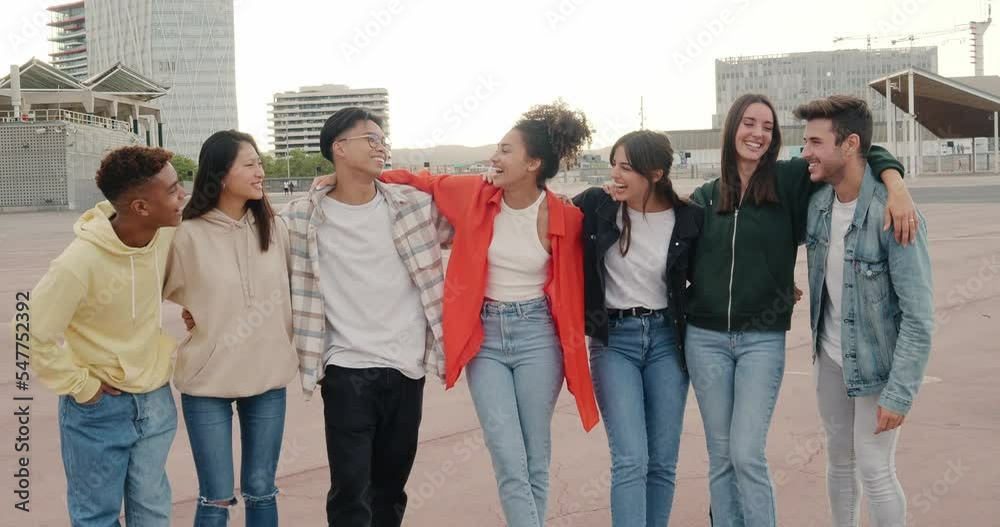 Group of diverse young friends enjoying and laughing in a city Group of diverse young friends enjoying and laughing in a city