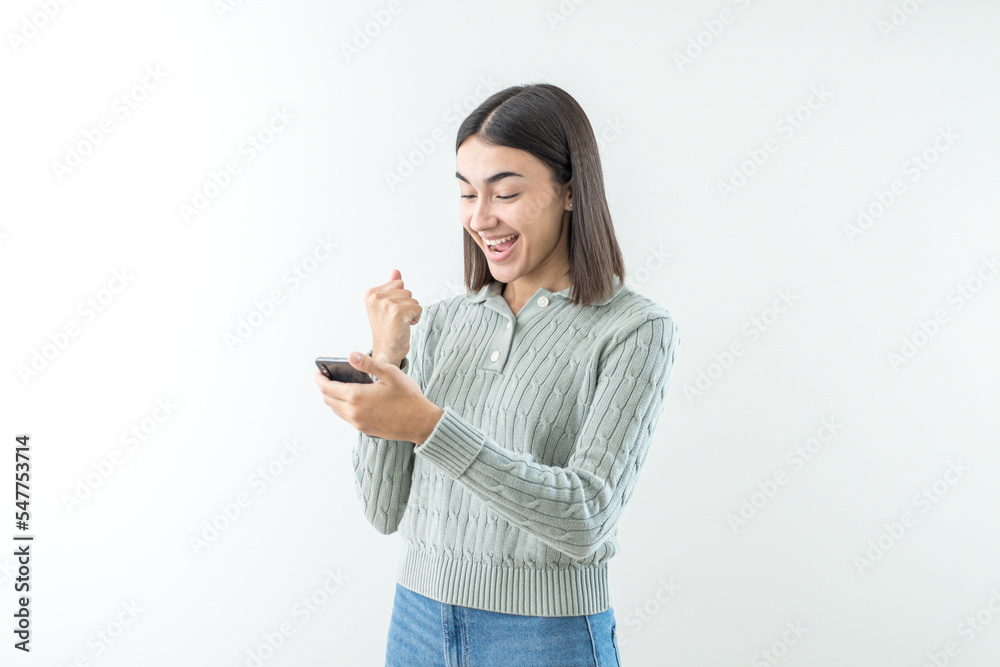 Happy and smiling young girl reads a good news on the tablet Happy and smiling young girl reads a good news on the tablet