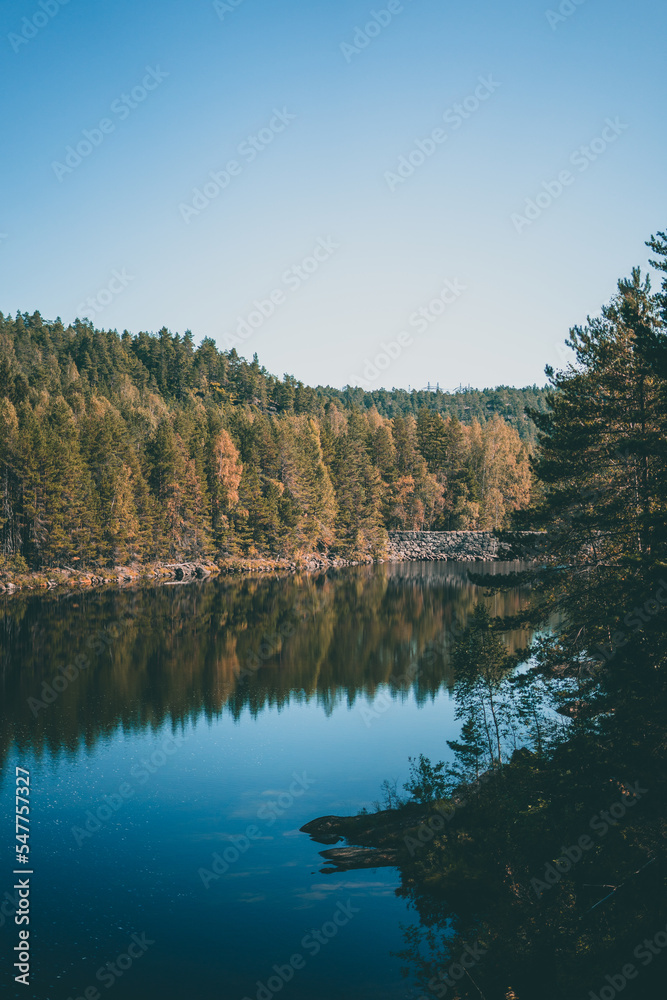 Beautiful lake at autumn in Norway reflecting