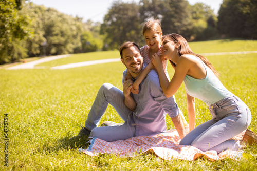 Happy young family with cut...