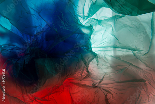 Billede på lærred transparent cellophane colored bags close-up background texture of plastic