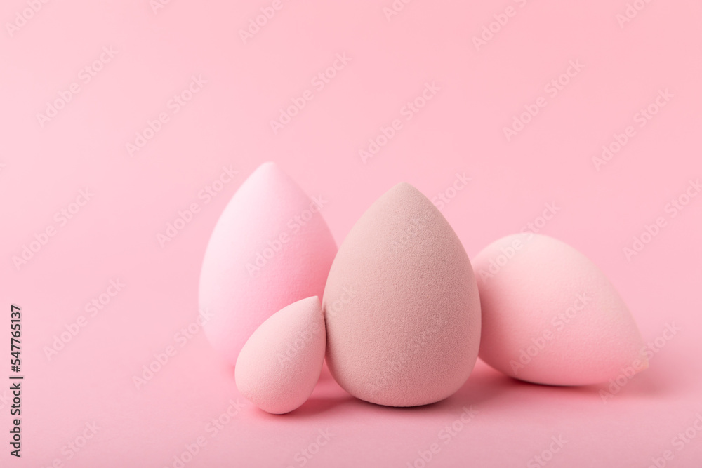 Beauty blender. Cosmetic sponge on a pink background. MOCAP. Sponge for applying foundation and concealer. Beauty concept. Space for text. Space for copy space.