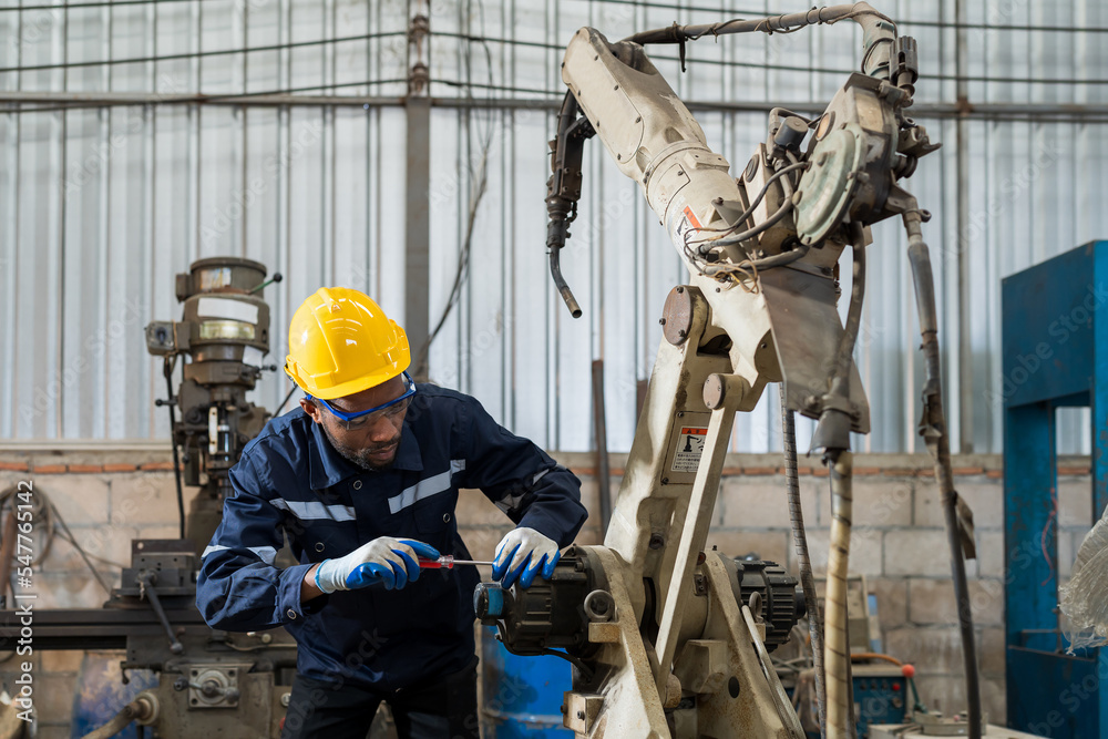 African American factory male engineer worker working with adept ...