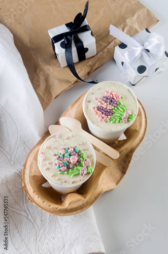 homemade cake to go in white disposable coffee cups, new confectionery trend, photo