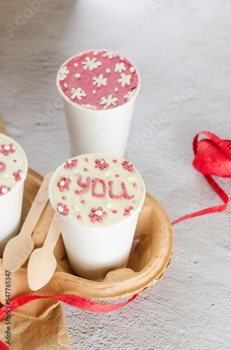 homemade cake  to go in white disposable coffee cups, new confectionery trend, photo