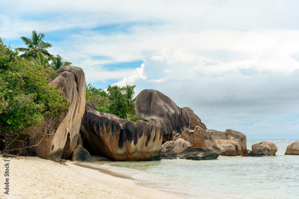 Beautiful tropical beach with palm trees at Seychelles. Anse Source d'Argen beach, island La Digue