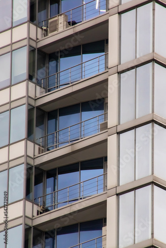 Balconies on a glass tall building closeup