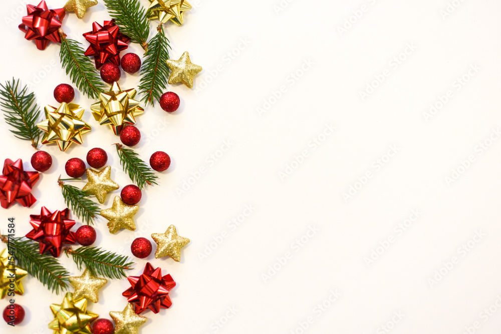 Christmas tree branches, red balls and stars, New Year's decor on a white background. Christmas frame for your text Christmas tree branches, red balls and stars, New Year's decor on a white background. Christmas frame for your text