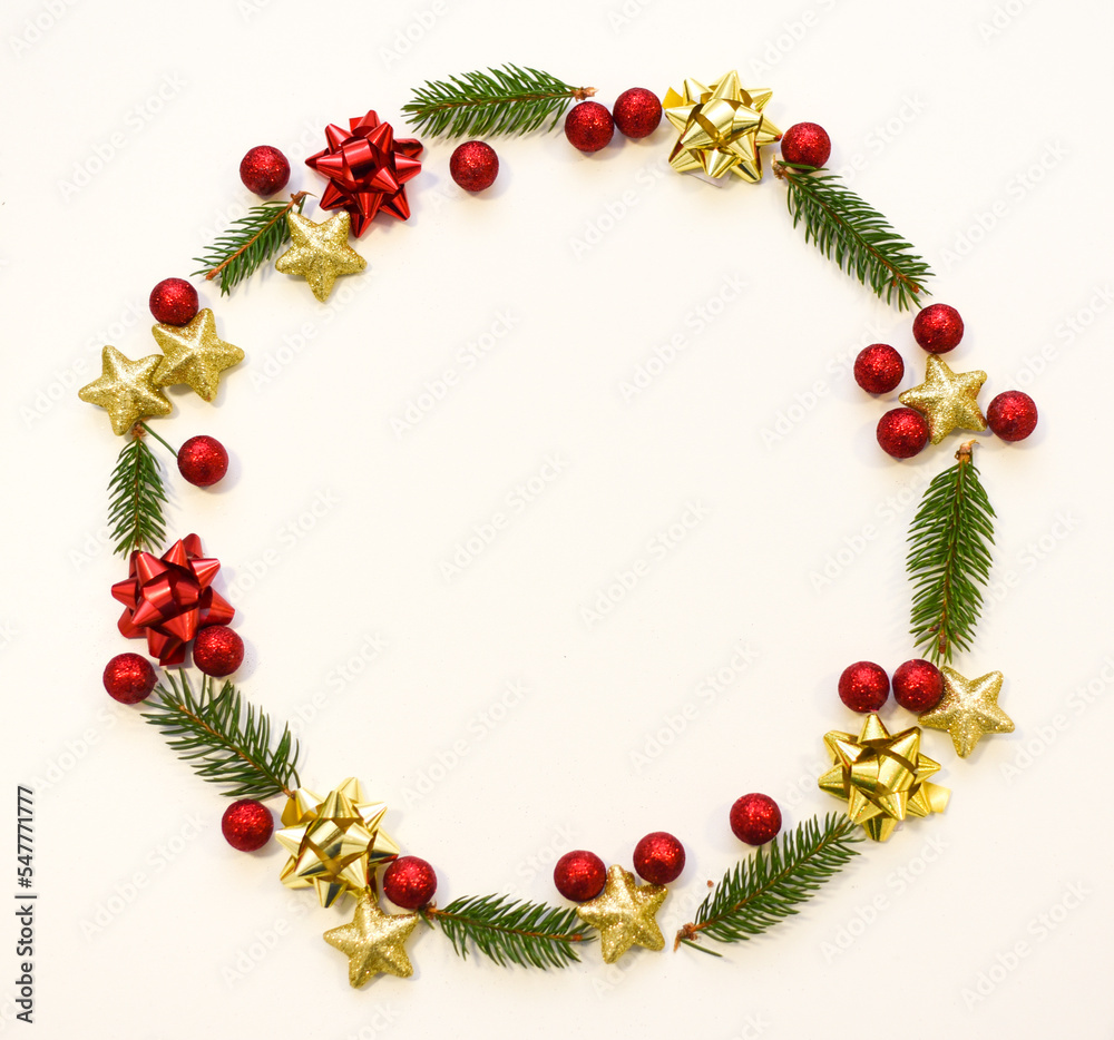 Christmas tree branches, red balls and stars, New Year's decor on a white background. Christmas frame for your text Christmas tree branches, red balls and stars, New Year's decor on a white background. Christmas frame for your text