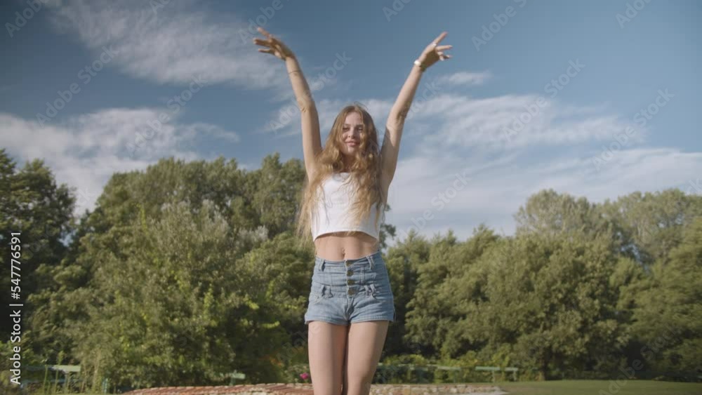 Pretty girl walking in the field near forest Pretty girl walking in the field near forest