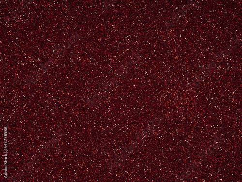 Dark Red glitter. Perfect holographic background or pattern of sparkling shiny glitter for decoration and design of Christmas, New Year, Valentine Day, 3d, xmas gift card or other holiday pictures.